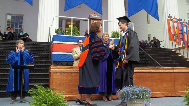 Svet Semov crossing the stage and shaking hands with President Janet Morgan Riggs ’77 at Commencement.
